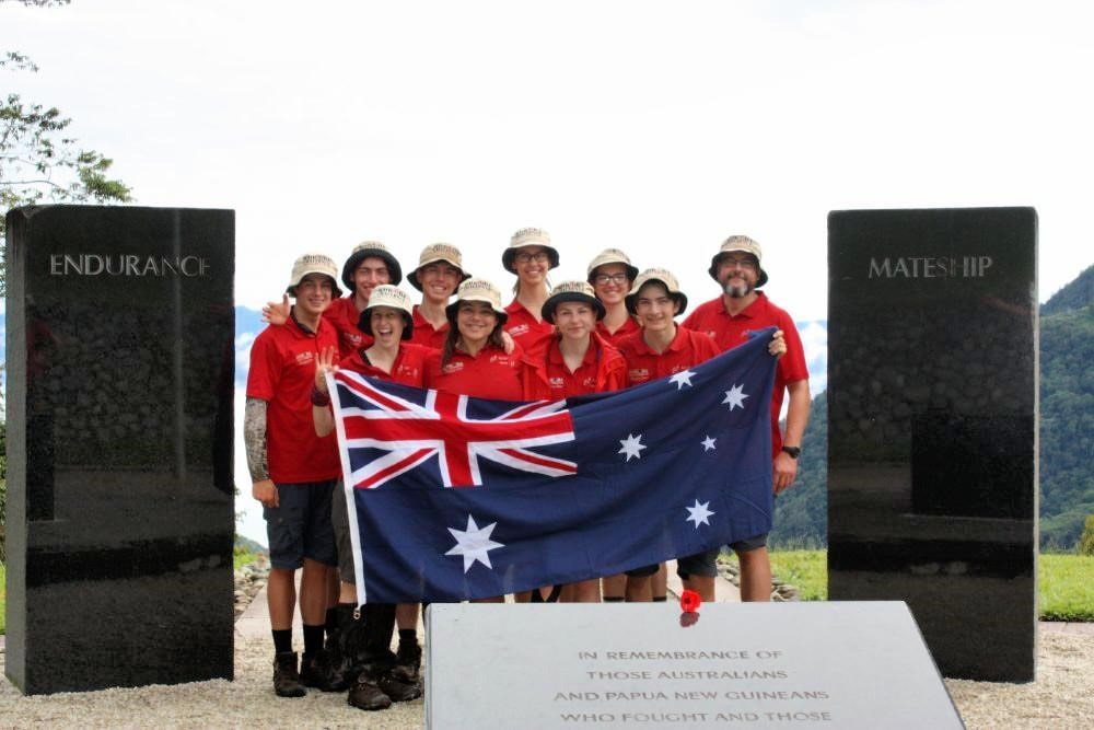 2019 Kokoda Kids at Papa New Guinea ANZAC Memorial with Australian Flag