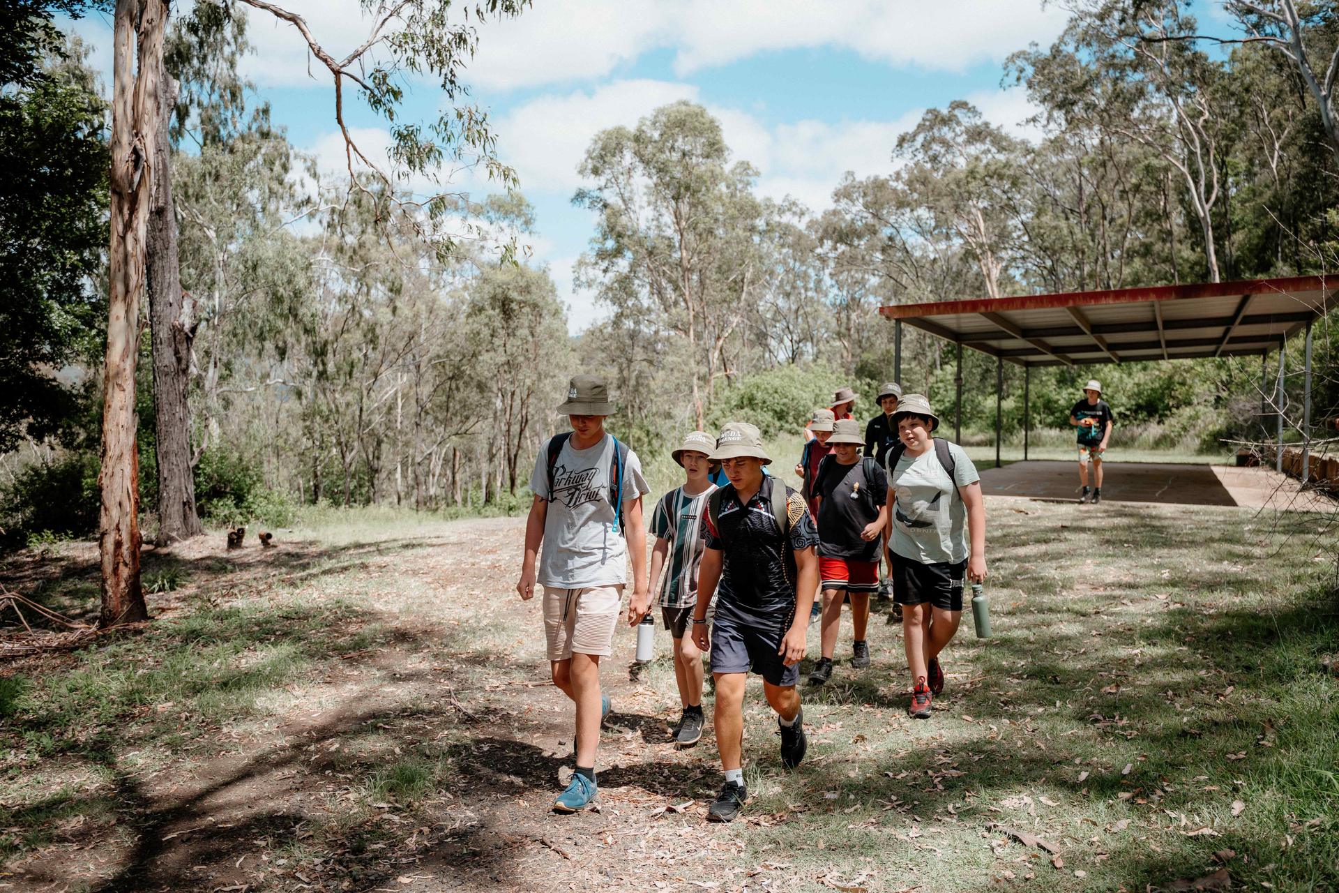 Students walking through the bush at Kokoda Park towards the shelter